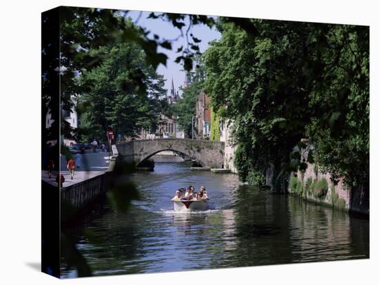 Tourists in Boat on Canal, Bruges, Belgium-Peter Scholey-Stretched Canvas