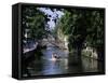 Tourists in Boat on Canal, Bruges, Belgium-Peter Scholey-Framed Stretched Canvas