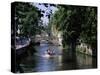 Tourists in Boat on Canal, Bruges, Belgium-Peter Scholey-Stretched Canvas