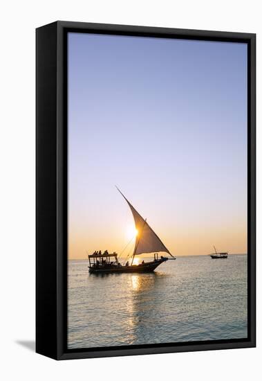 Tourists on a sunset cruise on the Indian Ocean, Nungwi, Island of Zanzibar, Tanzania, East Africa-Christian Kober-Framed Stretched Canvas