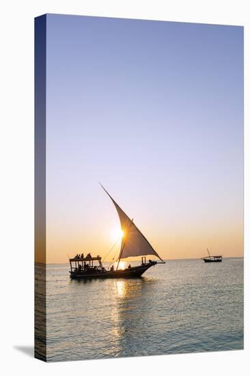 Tourists on a sunset cruise on the Indian Ocean, Nungwi, Island of Zanzibar, Tanzania, East Africa-Christian Kober-Stretched Canvas