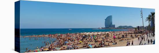 Tourists on the Beach with W Barcelona Hotel in the Background, Barceloneta Beach, Barcelona-null-Stretched Canvas