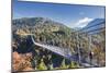 Tourists on the suspension bridge called Highline 179 framed by colorful woods in autumn, Ehrenberg-Roberto Moiola-Mounted Photographic Print