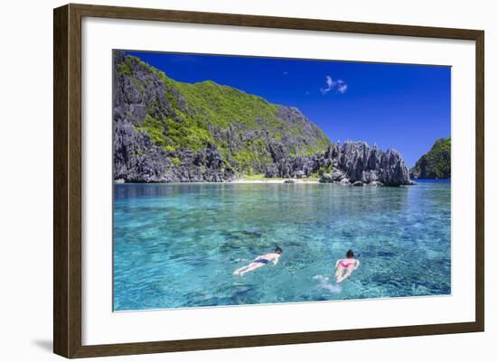 Tourists Swimming in the Crystal Clear Water in the Bacuit Archipelago, Palawan, Philippines-Michael Runkel-Framed Photographic Print