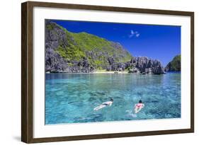 Tourists Swimming in the Crystal Clear Water in the Bacuit Archipelago, Palawan, Philippines-Michael Runkel-Framed Photographic Print