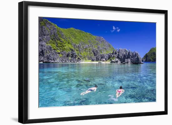 Tourists Swimming in the Crystal Clear Water in the Bacuit Archipelago, Palawan, Philippines-Michael Runkel-Framed Photographic Print