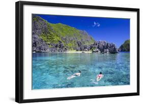 Tourists Swimming in the Crystal Clear Water in the Bacuit Archipelago, Palawan, Philippines-Michael Runkel-Framed Photographic Print