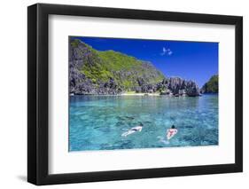 Tourists Swimming in the Crystal Clear Water in the Bacuit Archipelago, Palawan, Philippines-Michael Runkel-Framed Photographic Print