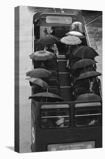 Tourists under Umbrellas on Open Top Bus, 1976-Kent Gavin-Stretched Canvas