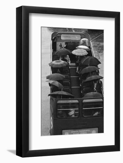 Tourists under Umbrellas on Open Top Bus, 1976-Kent Gavin-Framed Photographic Print