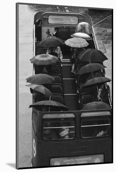 Tourists under Umbrellas on Open Top Bus, 1976-Kent Gavin-Mounted Photographic Print