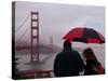 Tourists Use an Umbrella During a Light Rain, Looking at the Golden Gate Bridge in San Francisco-null-Stretched Canvas