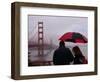 Tourists Use an Umbrella During a Light Rain, Looking at the Golden Gate Bridge in San Francisco-null-Framed Photographic Print