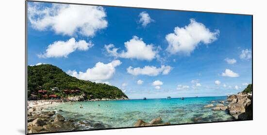 Toursits enjoy the clear water and sun at a beach on the Thai island of Koh Tao, Thailand-Logan Brown-Mounted Photographic Print