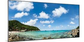 Toursits enjoy the clear water and sun at a beach on the Thai island of Koh Tao, Thailand-Logan Brown-Mounted Photographic Print