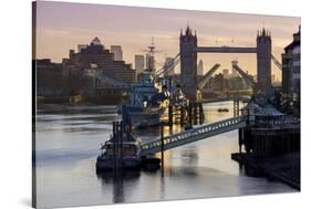 Tower Bridge raising deck with HMS Belfast on the River Thames, London, England, United Kingdom, Eu-Charles Bowman-Stretched Canvas