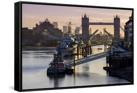 Tower Bridge raising deck with HMS Belfast on the River Thames, London, England, United Kingdom, Eu-Charles Bowman-Framed Stretched Canvas