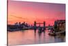 Tower Bridge, River Thames and HMS Belfast at sunrise with pink sky, and Canary Wharf-Ed Hasler-Stretched Canvas