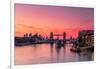 Tower Bridge, River Thames and HMS Belfast at sunrise with pink sky, and Canary Wharf-Ed Hasler-Framed Photographic Print