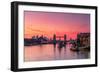 Tower Bridge, River Thames and HMS Belfast at sunrise with pink sky, and Canary Wharf-Ed Hasler-Framed Photographic Print