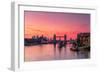 Tower Bridge, River Thames and HMS Belfast at sunrise with pink sky, and Canary Wharf-Ed Hasler-Framed Photographic Print