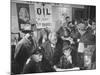 Town Residents Standing in Gas Station, Discussing Problems Caused by Oil Boom-Bernard Hoffman-Mounted Photographic Print
