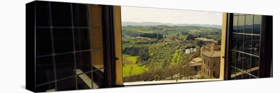 Town Viewed Through a Window, Siena, Siena Province, Tuscany, Italy-null-Stretched Canvas