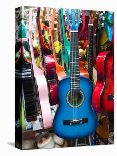 Toy Guitars, Olvera Street Market, El Pueblo de Los Angeles, Los Angeles, California, USA-Walter Bibikow-Stretched Canvas