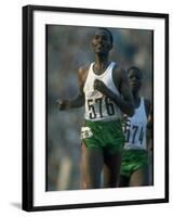 Track Athlete Kip Keino in Action at the Summer Olympics-John Dominis-Framed Premium Photographic Print