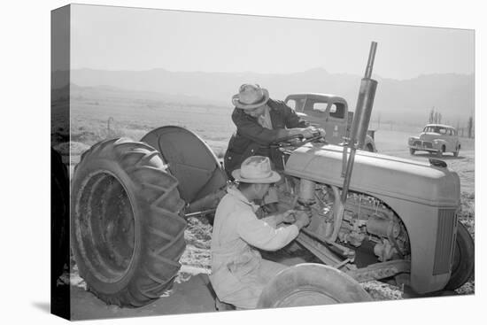 Tractor Repair: Driver Benji Iguchi, Mechanic Henry Hanawa, Manzanar Relocation Center, California-Ansel Adams-Stretched Canvas
