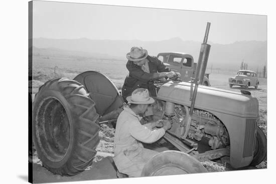 Tractor Repair: Driver Benji Iguchi, Mechanic Henry Hanawa, Manzanar Relocation Center, California-Ansel Adams-Stretched Canvas