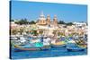 Traditional brightly painted fishing boats in the harbour at Marsaxlokk, Malta, Mediterranean, Euro-Martin Child-Stretched Canvas