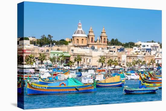 Traditional brightly painted fishing boats in the harbour at Marsaxlokk, Malta, Mediterranean, Euro-Martin Child-Stretched Canvas