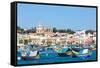 Traditional brightly painted fishing boats in the harbour at Marsaxlokk, Malta, Mediterranean, Euro-Martin Child-Framed Stretched Canvas