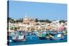 Traditional brightly painted fishing boats in the harbour at Marsaxlokk, Malta, Mediterranean, Euro-Martin Child-Stretched Canvas