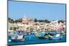 Traditional brightly painted fishing boats in the harbour at Marsaxlokk, Malta, Mediterranean, Euro-Martin Child-Mounted Photographic Print