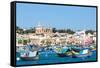 Traditional brightly painted fishing boats in the harbour at Marsaxlokk, Malta, Mediterranean, Euro-Martin Child-Framed Stretched Canvas