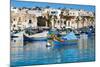 Traditional brightly painted fishing boats in the harbour at Marsaxlokk, Malta, Mediterranean, Euro-Martin Child-Mounted Photographic Print