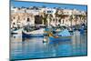 Traditional brightly painted fishing boats in the harbour at Marsaxlokk, Malta, Mediterranean, Euro-Martin Child-Mounted Photographic Print