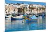 Traditional brightly painted fishing boats in the harbour at Marsaxlokk, Malta, Mediterranean, Euro-Martin Child-Mounted Photographic Print