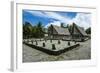 Traditional House with Stone Money in Front-Michael Runkel-Framed Photographic Print