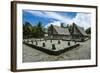 Traditional House with Stone Money in Front-Michael Runkel-Framed Photographic Print