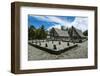 Traditional House with Stone Money in Front-Michael Runkel-Framed Photographic Print