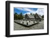 Traditional House with Stone Money in Front-Michael Runkel-Framed Photographic Print