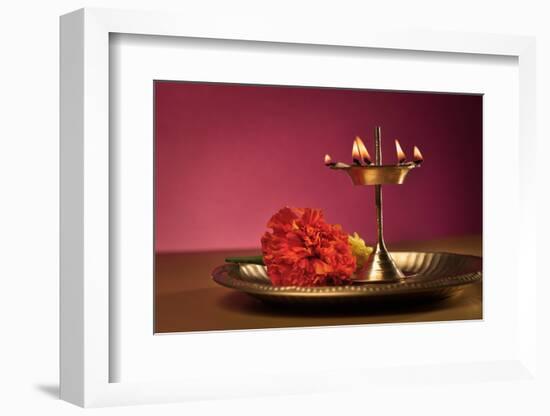 Traditional Indian Lamp and Flowers in a Plate-satel-Framed Photographic Print