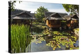 Traditional Kampung Style Rooms over Carp Ponds at the Kampung Sumber Alam Hot Springs Hotel-Rob-Stretched Canvas