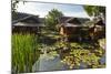 Traditional Kampung Style Rooms over Carp Ponds at the Kampung Sumber Alam Hot Springs Hotel-Rob-Mounted Photographic Print