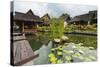 Traditional Kampung Style Rooms over Carp Ponds at the Kampung Sumber Alam Hot Springs Hotel-Rob-Stretched Canvas