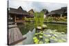 Traditional Kampung Style Rooms over Carp Ponds at the Kampung Sumber Alam Hot Springs Hotel-Rob-Stretched Canvas