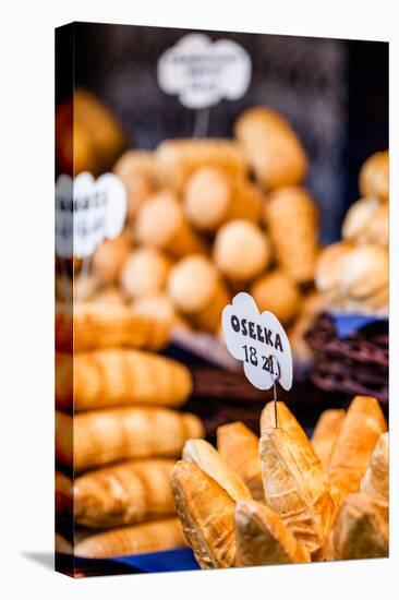 Traditional Polish Smoked Cheese Oscypek on Outdoor Market in Krakow, Poland.-Curioso Travel Photography-Stretched Canvas